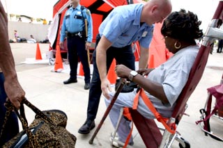 Government - HPD Officer Helps Evacuee picture